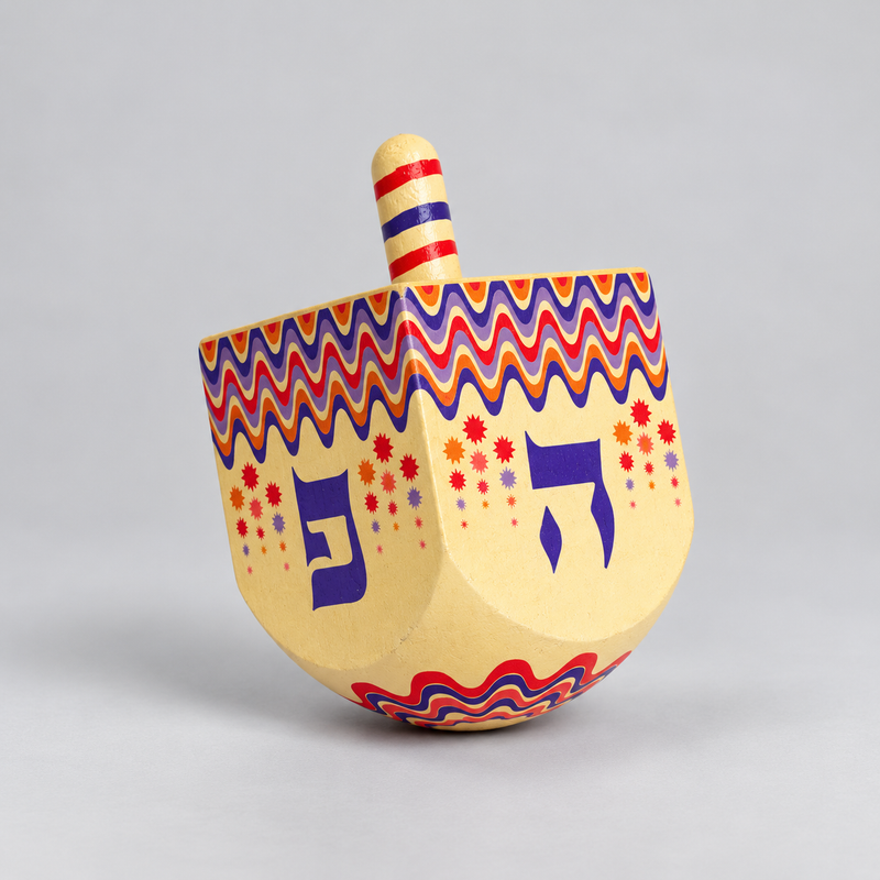 cream and colourful wooden dreidel 